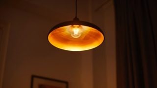 A lamp with a bulb that has a warm cosy glow